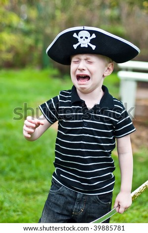 stock-photo-young-boy-wearing-pirate-hat-crying-39885781.jpg