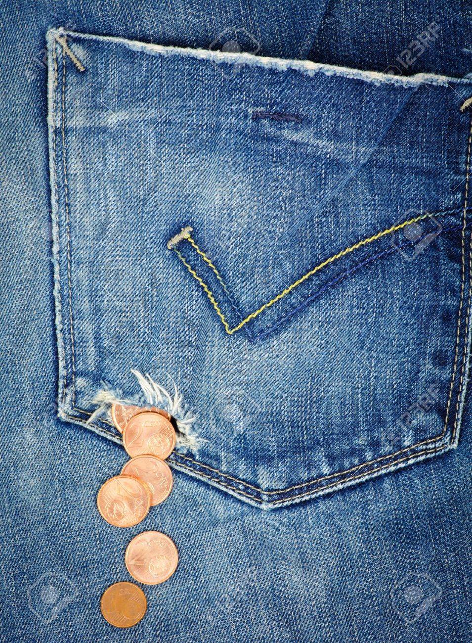 12151705-Money-fall-out-from-a-hole-in-jeans-pocket-Stock-Photo.jpg
