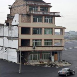 road built around house